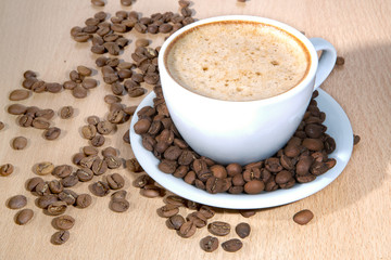 Coffee cup and coffee beans. Close up