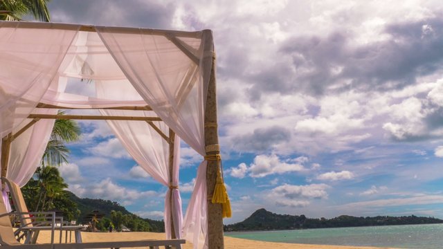 Tropical island beach view and clouds running jn blue sky. 4K