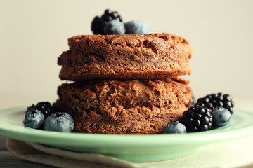 Cake with berries on wooden table