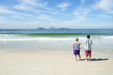 Visitors look out over a scenic view of Ipanema Beach in Rio de Janeiro Brazil on a calm summer morning