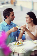 Young couple in street cafe