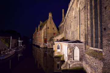 Fototapeta na wymiar Sint-Janshospitaal from river at night, Bruges