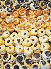 Pile of tiny round traditional czech cakes (kolache).