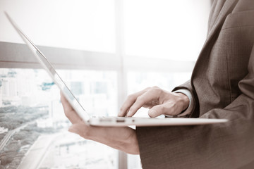 Businessman analyzing investment charts with laptop. Accounting
