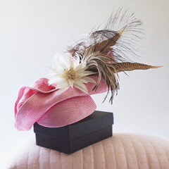 Pink fashion races hat with flower and feathers