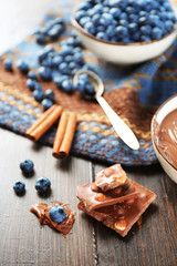 Beautiful composition with chocolate cream and blueberries