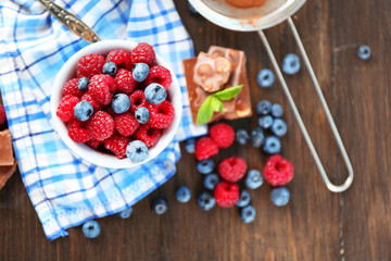 Beautiful composition with chocolate cream and ripe berries