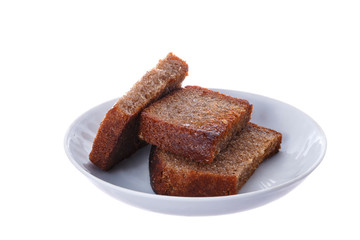 Grilled slices of rye bread on a white plate.
