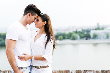 Naklejka premium Young beautiful couple rubbing noses as a sign of love