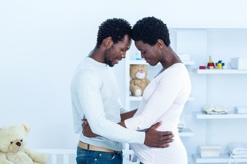 Obraz premium Husband embracing wife while touching heads 