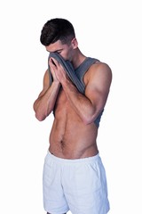 Fototapeta premium Man wiping his face with shirt