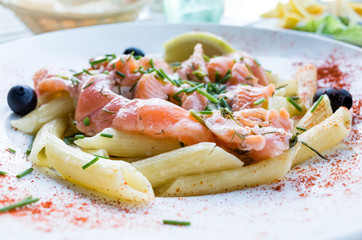 tasty pasta with salmon on a the table