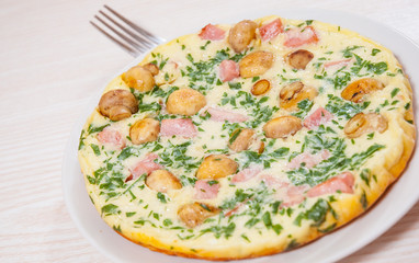omelet with mushrooms, ham and cheese