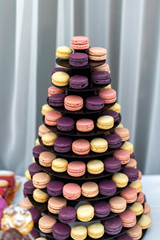 Sweet pyramid of the colorful french macaroons for the birthday, event or wedding