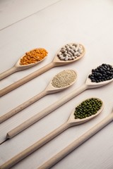 Wooden spoons of pulses and seeds
