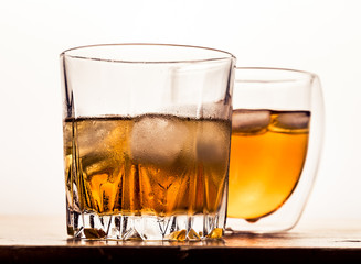 Two different glasses of whiskey 