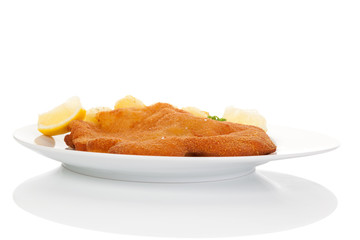 Wiener schnitzel on plate isolated.