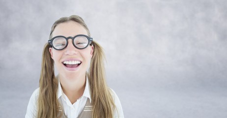 Composite image of female geeky hipster smiling at camera