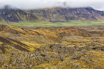 Icelandic landscape with lava fields and mountains.