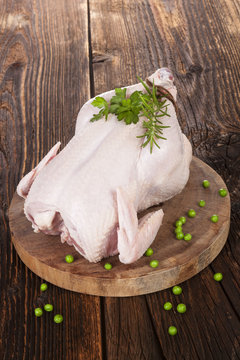 Raw whole chicken.