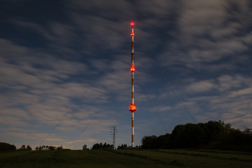 high radio tower at night