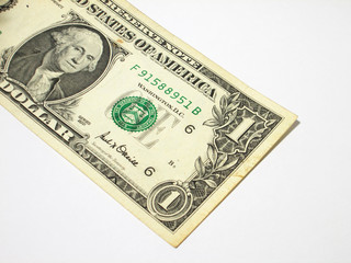 Isolated one dollar banknotes on a white background, featuring a portrait of President George Washington