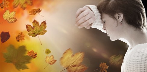 Composite image of sad pretty brunette leaning against wall