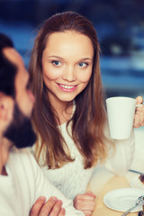 happy couple meeting and drinking tea or coffee