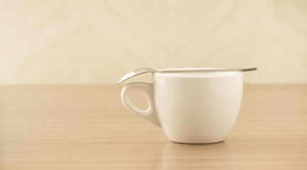 Empty coffee cup on wooden table