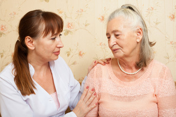 Doctor explaining diagnosis to his female patient