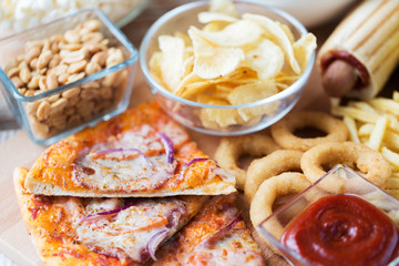 close up of fast food snacks on wooden table