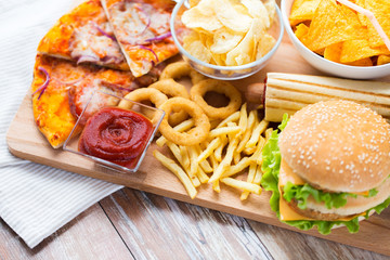 close up of fast food snacks on wooden table