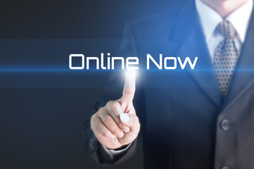 A Businessman holding a white sign with the message online now. Can bring to the medium of your ad.