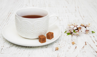 Cup of tea and spring blossom