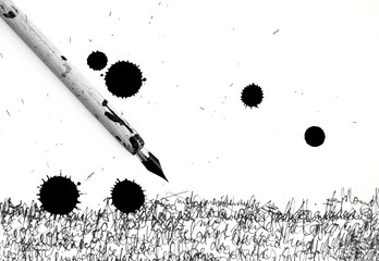 ancient pen and inkblot above on calligraphy paper - studio shot