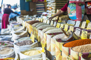 Vivid oriental central asian market with bags full of various sp