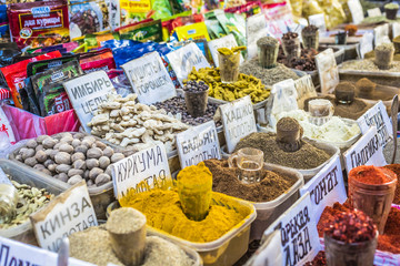 Vivid oriental central asian market with bags full of various sp