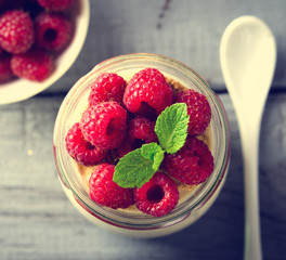 Healthy breakfast - fresh Greek yogurt with raspberries and mint