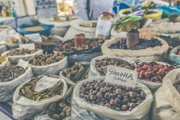Vivid oriental central asian market with bags full of various sp