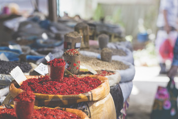 Vivid oriental central asian market with bags full of various sp