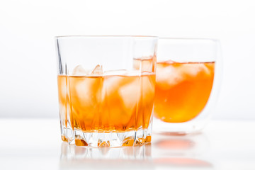 Two different glasses of whiskey 