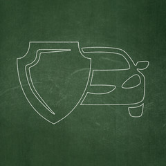 Insurance concept: Car And Shield on chalkboard background