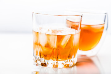 Two different glasses of whiskey 