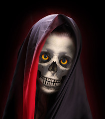 Portrait of death. Skeleton with smiling skull  dressed in veil or burka.