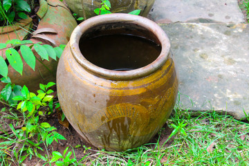 Big earthen jar or Water jar in the countryside,Thailand.