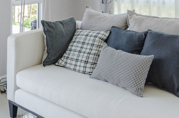 modern white sofa in modern living room with pillows