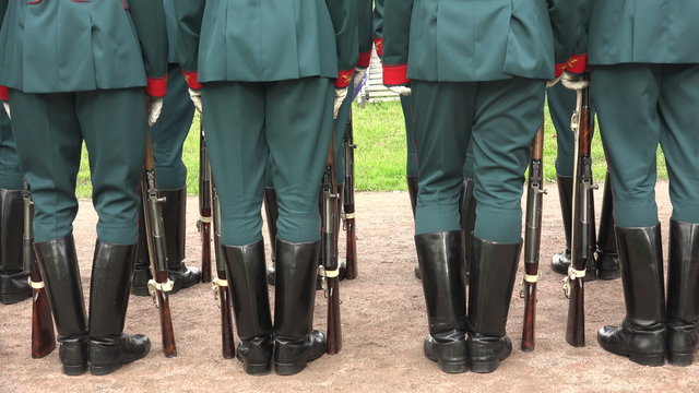 Formation of soldiers. Boots, rifle butts. 4K.