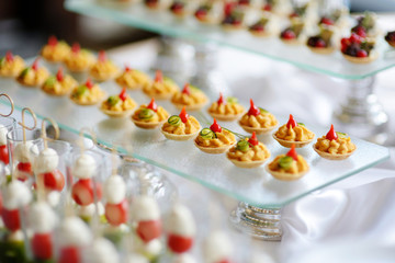 Plates with assorted snacks on an event party