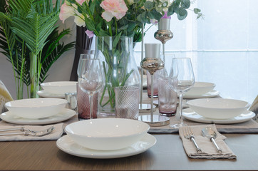 table set on wooden dinning room with chair