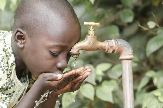 African Black Boy Drinking Fresh Clean Water